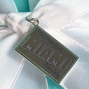 Tiffany & Co. New, Authentic “Miami” Florida Sterling Silver Postcard Charm.